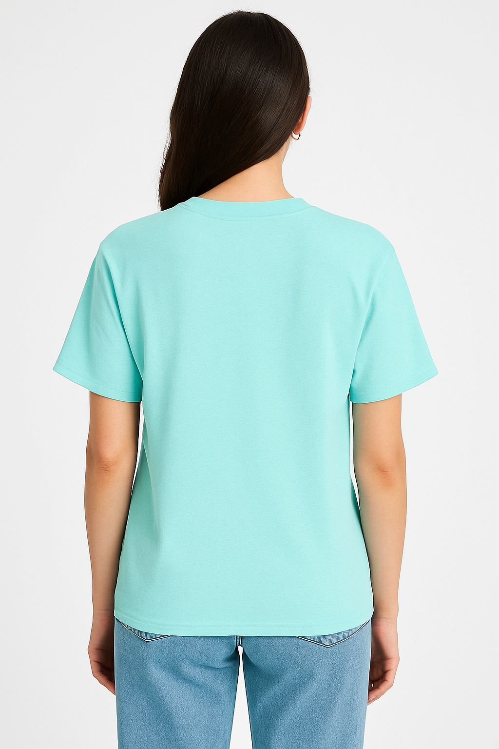 Person wearing a light blue t-shirt and jeans on a white background