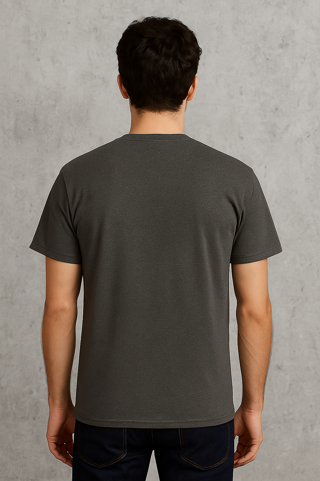 Person wearing a plain dark gray t-shirt against a gray background