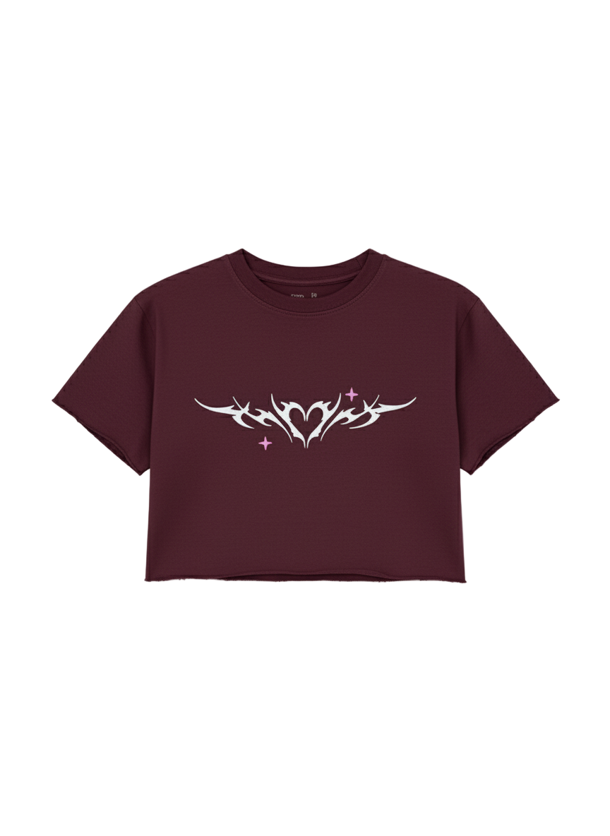 Maroon t-shirt with white tribal design on a light gray background