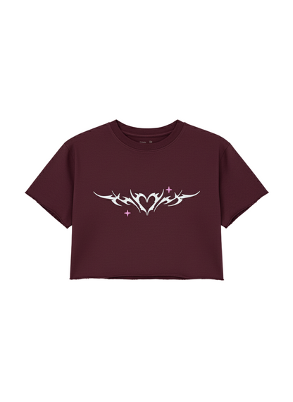 Maroon t-shirt with white tribal design on a light gray background