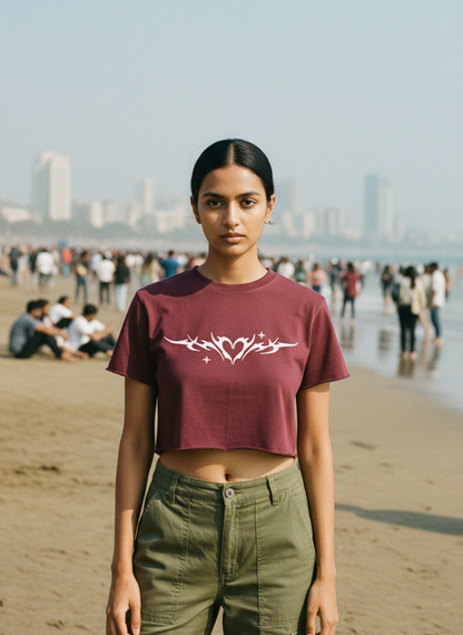 Woman standing on a beach with a city skyline in the background