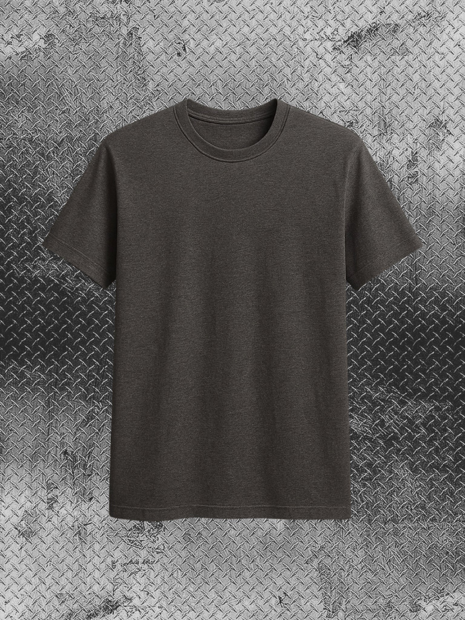 Dark gray t-shirt on a textured metallic background